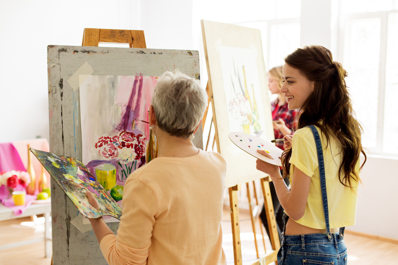 Happy Women Painting at Art School Studio